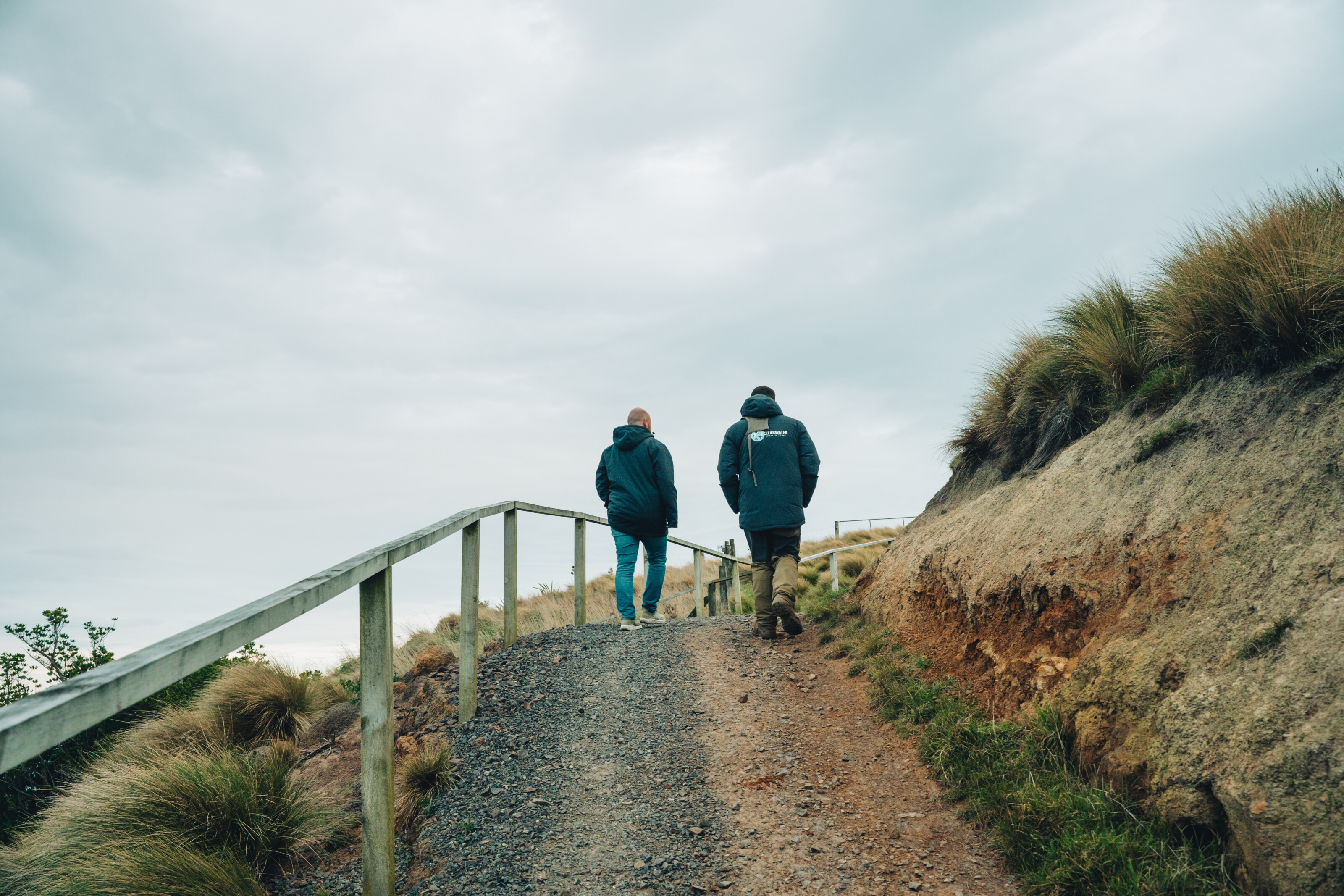 Guests walk along a path at the Clearwater family farm.